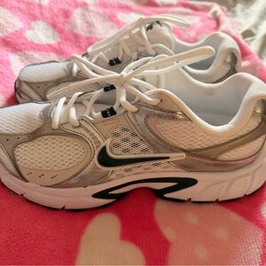 Nike women’s White and Silver Running Sneakers with Black Swoosh